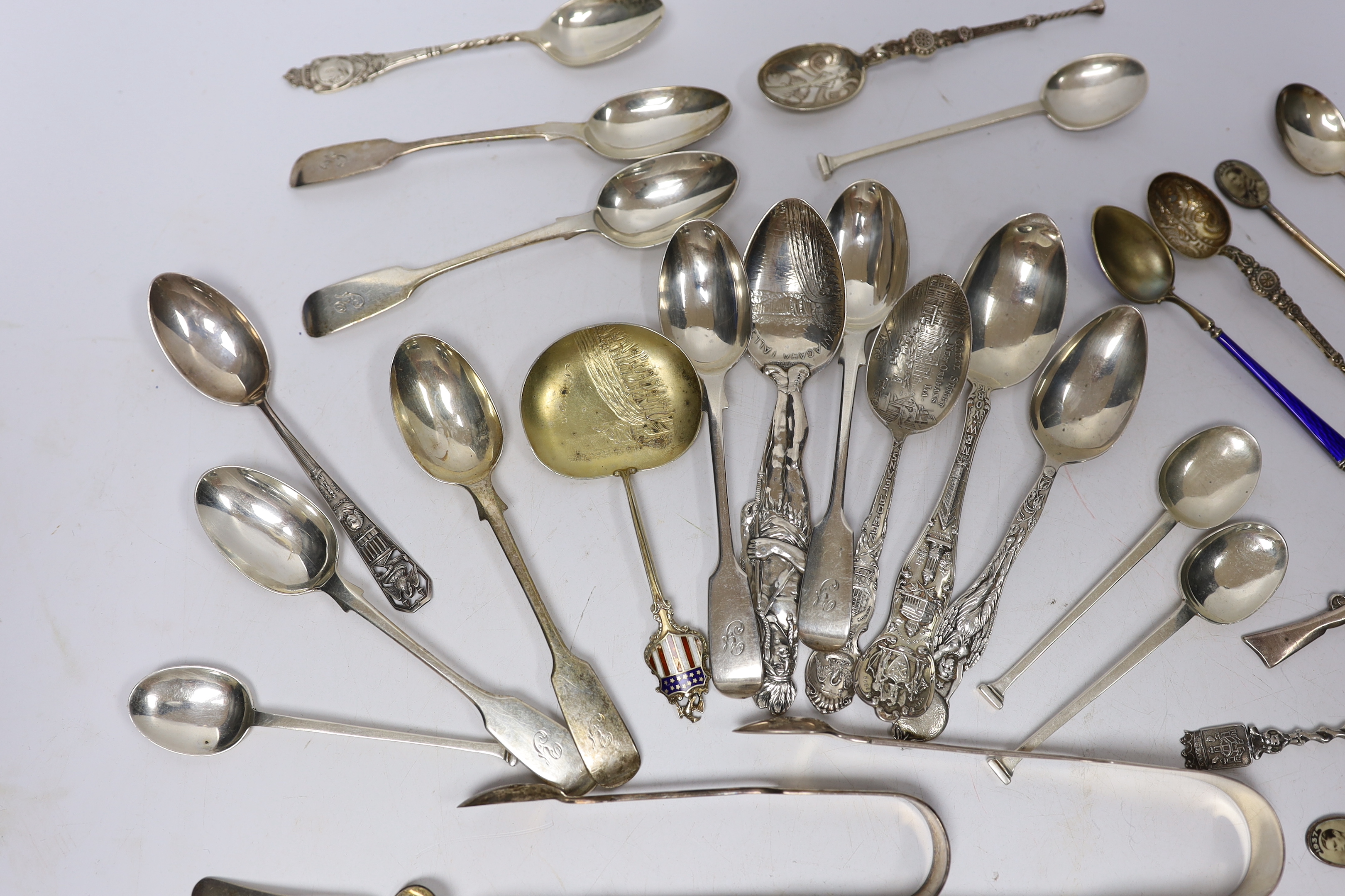A small group of assorted silver and sterling small spoons, including commemorative etc. and some continental white metal spoons.